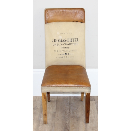 91 - A set of 4 modern leather and canvas dining chairs with wooden legs, the backs with Paris related st... 