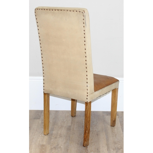 91 - A set of 4 modern leather and canvas dining chairs with wooden legs, the backs with Paris related st... 