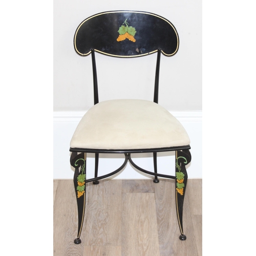 104 - 2 black painted metal chairs with cream upholstered seats, painted with grape and vine decoration, e... 