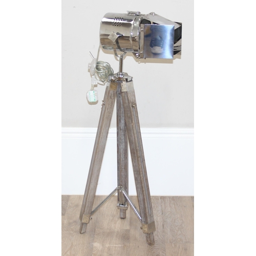 239 - Industrial style floor-standing search light lamp, with wooden base and chrome head, approx 144cm fu... 