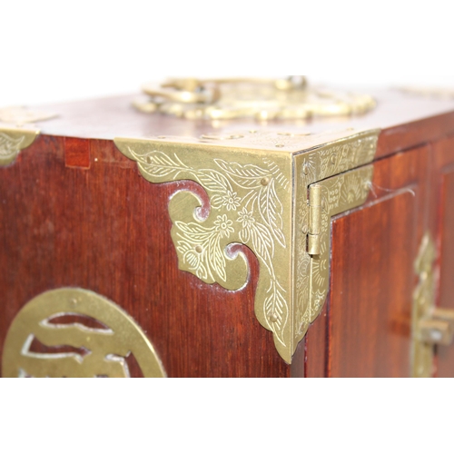 275 - Chinese style hardwood jewellery book with ornate brass corners and fixings, 4 internal drawers and ... 