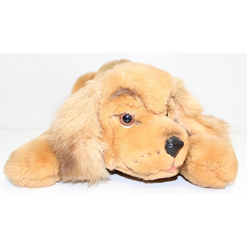 609 - Steiff stuffed dog with original button in ear and red collar, approx 43cm nose-to-tail