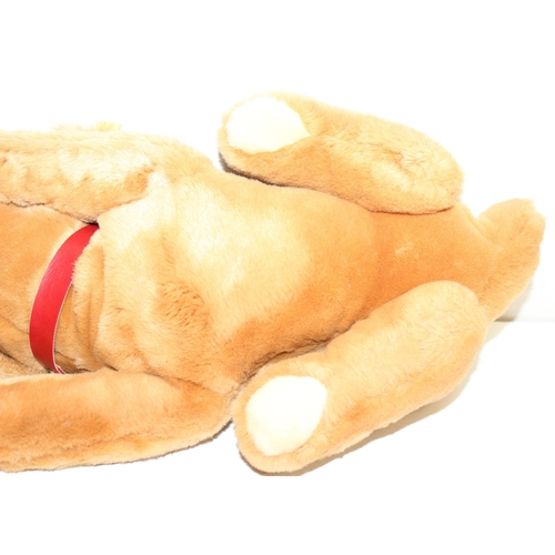 609 - Steiff stuffed dog with original button in ear and red collar, approx 43cm nose-to-tail