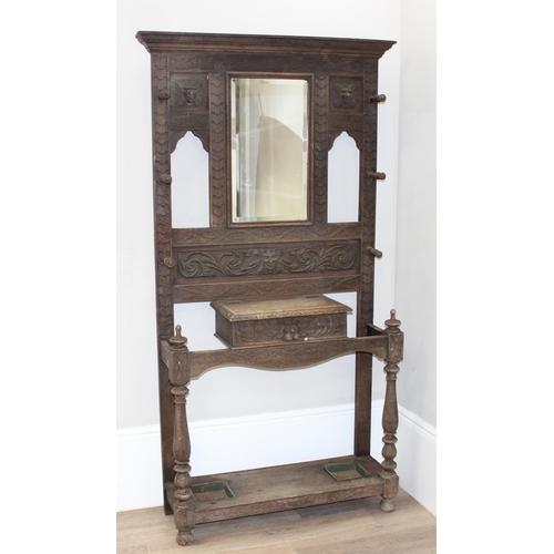 78 - Antique carved oak hallstand with Green Man mask decoration, approx 103cm x 30cm x 189cm