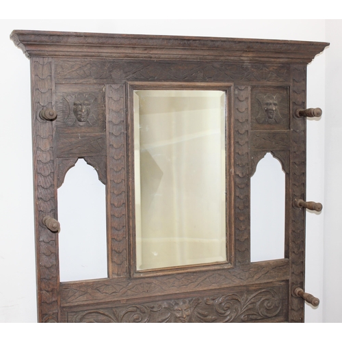 78 - Antique carved oak hallstand with Green Man mask decoration, approx 103cm x 30cm x 189cm