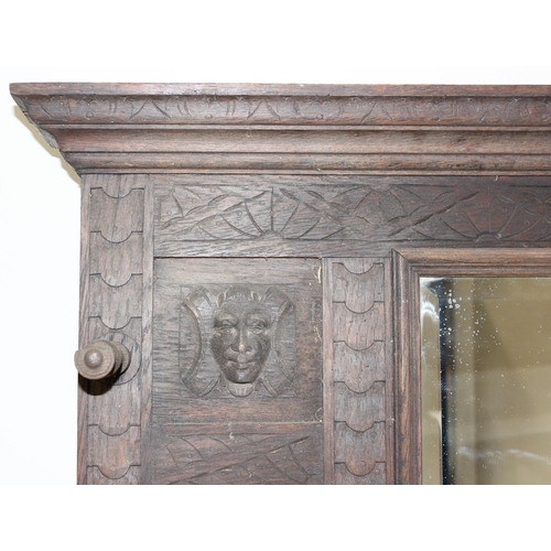 78 - Antique carved oak hallstand with Green Man mask decoration, approx 103cm x 30cm x 189cm