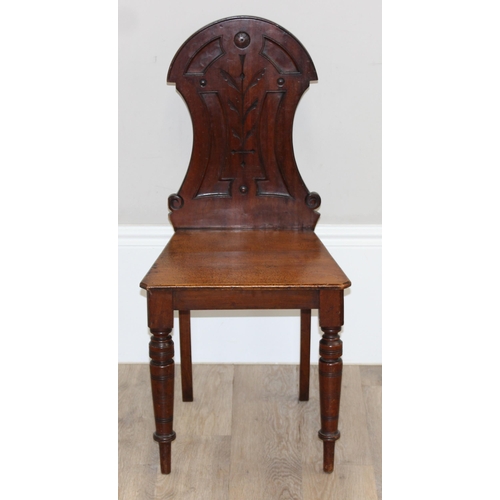 88 - A pair of Victorian mahogany hall chairs with carved backs, both approx 90cm tall