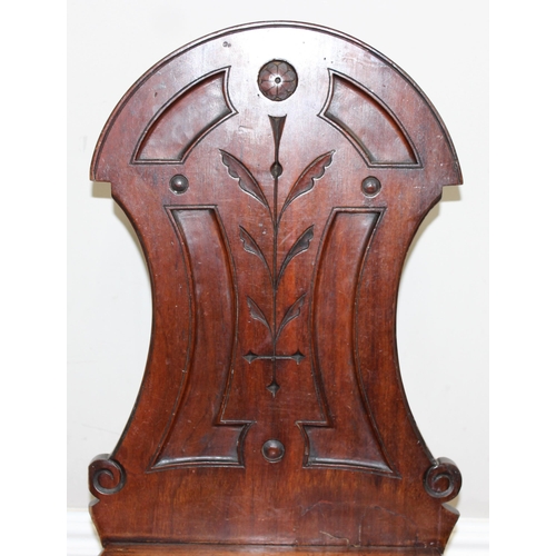 88 - A pair of Victorian mahogany hall chairs with carved backs, both approx 90cm tall