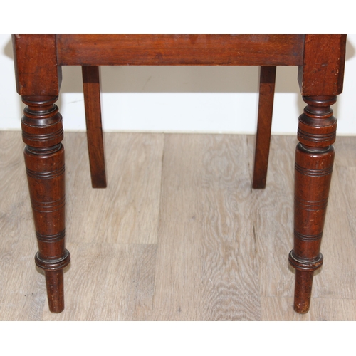 88 - A pair of Victorian mahogany hall chairs with carved backs, both approx 90cm tall