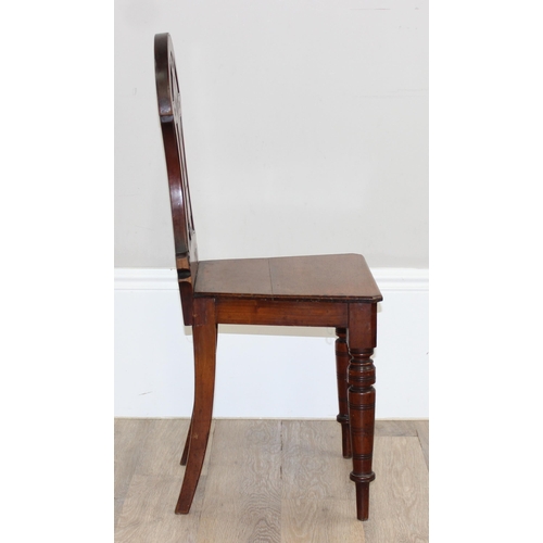 88 - A pair of Victorian mahogany hall chairs with carved backs, both approx 90cm tall