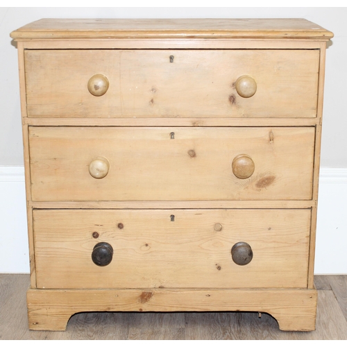 7 - An antique pine 3 drawer chest of drawers with bun handles, approx 79cm wide x 40cm deep x 82cm tall