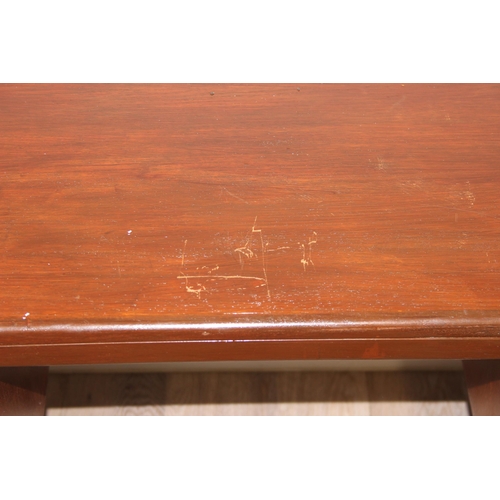 103 - A retro G-Plan desk or dressing table base with 2 pairs of drawers flanking a hidden drawer to centr... 