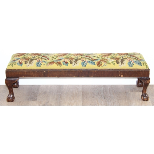 101 - A long low antique tapestry topped footstool with ball and claw feet, approx 93cm wide x 25cm deep x... 