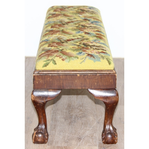 101 - A long low antique tapestry topped footstool with ball and claw feet, approx 93cm wide x 25cm deep x... 