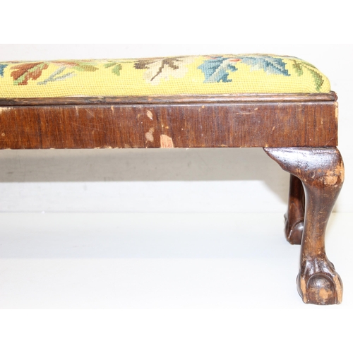 101 - A long low antique tapestry topped footstool with ball and claw feet, approx 93cm wide x 25cm deep x... 