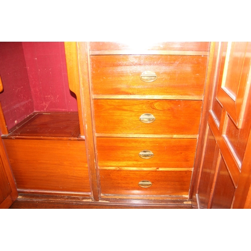 59 - An antique oak and burr wood wardrobe or hall cupboard with carved central panels and 3 doors, the 2... 