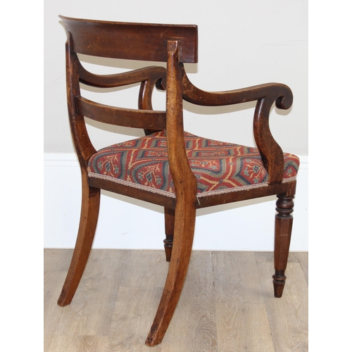 117 - A 19th century mahogany scroll arm carver or library chair, T.R. Roberts of Islington ivorine plaque... 