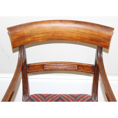 117 - A 19th century mahogany scroll arm carver or library chair, T.R. Roberts of Islington ivorine plaque... 