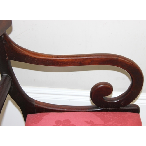 139 - A Georgian scroll arm mahogany carver or library chair with later upholstered red fabric seat, appro... 