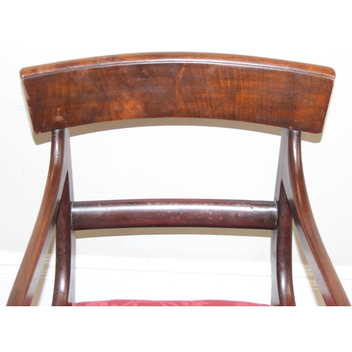 139 - A Georgian scroll arm mahogany carver or library chair with later upholstered red fabric seat, appro... 