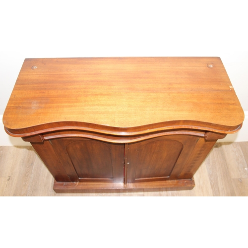 93 - A Victorian mahogany sideboard or chiffonier base with hidden frieze drawer over a 2 door cupboard, ... 