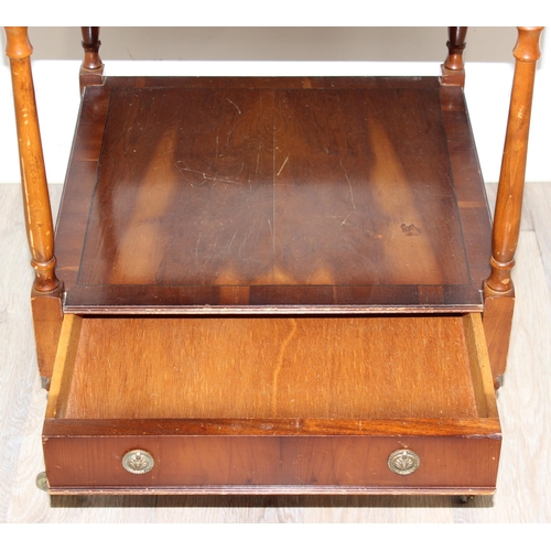 41 - Vintage wooden bedside table on brass castors and single drawer, approx 46cm x 46cm x 62cm