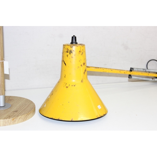 233 - A yellow painted Anglepoise style mounted bench lamp with no base and an Ikea lamp with fabric shade... 