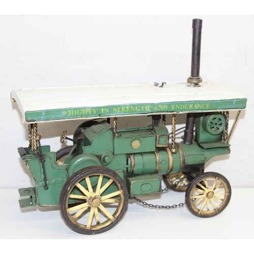 607 - Vintage tin-plate Showman's steam engine in green, approx 32cm