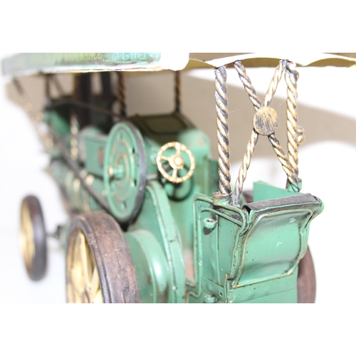 607 - Vintage tin-plate Showman's steam engine in green, approx 32cm