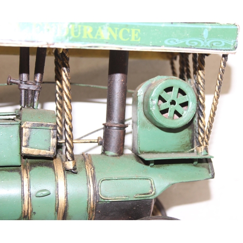 607 - Vintage tin-plate Showman's steam engine in green, approx 32cm