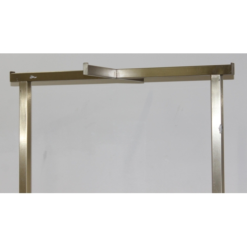 47 - A Hollywood Regency style brushed gilt metal and marble effect clothes display rail or shop display,... 