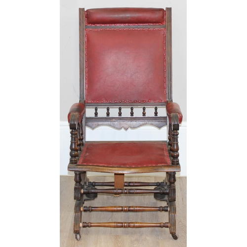 173 - An antique rocking chair with red leather effect upholstery, possibly American, approx 55cm wide x 1... 