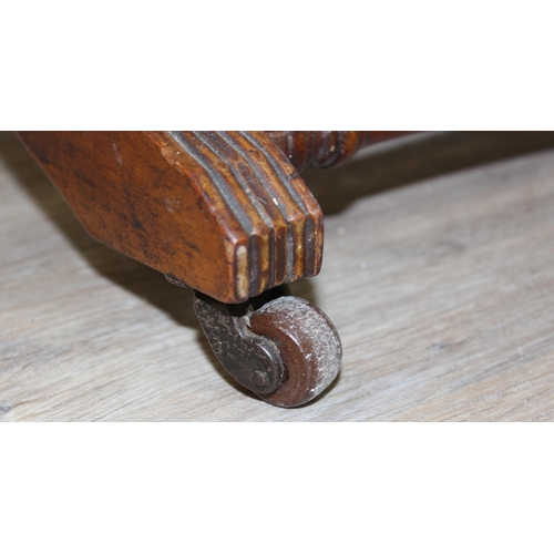 173 - An antique rocking chair with red leather effect upholstery, possibly American, approx 55cm wide x 1... 