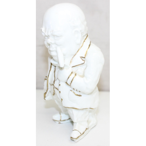 1427 - White glazed porcelain caricature figurine of Sir Winston Churchill, with gilt highlights, marked 'L... 