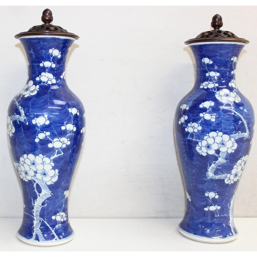 1428 - A pair of Chinese blue and white vases decorated with Prunus flowers and unusual pierced and carved ... 