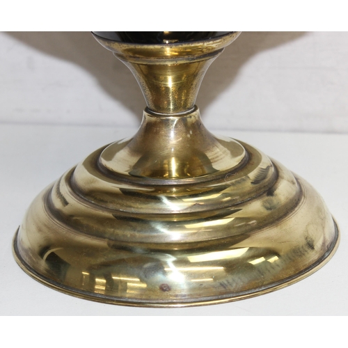 245 - A vintage oil lamp with brass base, black printed glass reservoir and green glass shade, approx 55cm... 