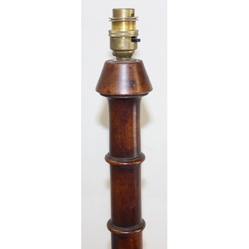 247 - A vintage mahogany standard lamp with reeded column over acanthus carving, approx 160cm tall