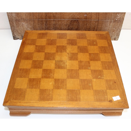 626 - A vintage boxed wooden cased chess set and a vintage oak shove halfpenny board, the chess board appr... 