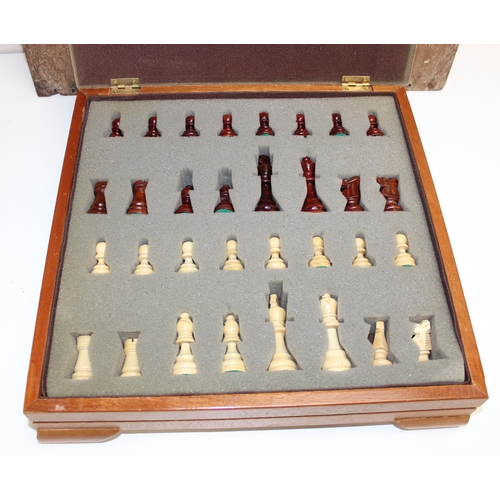 626 - A vintage boxed wooden cased chess set and a vintage oak shove halfpenny board, the chess board appr... 