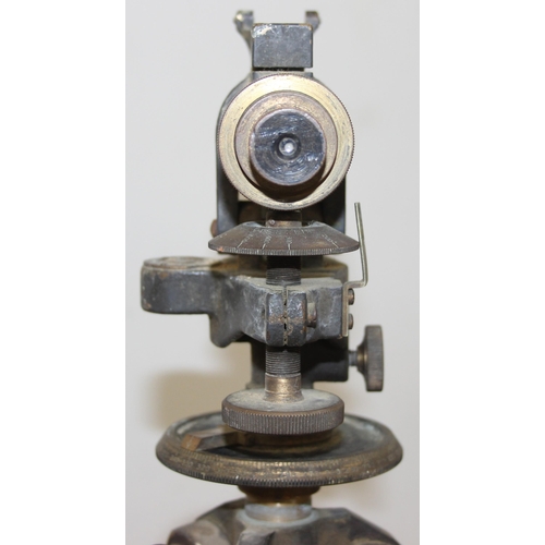 727 - A vintage painted brass theodolite on wooden tripod base, both seemingly unmarked, approx 145cm tall... 