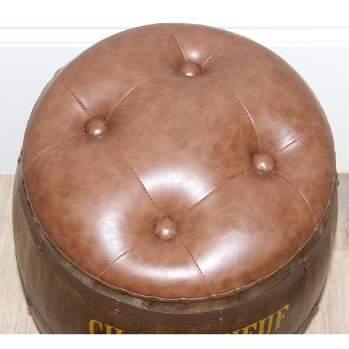 167 - A vintage style barrel formed stool with faux leather button top and Chateauneuf Du-Pape related adv... 