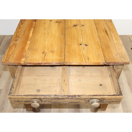 3 - An antique rustic pitch pine farmhouse table with single drawer, approx 145cm wide x 89cm deep x 75c... 