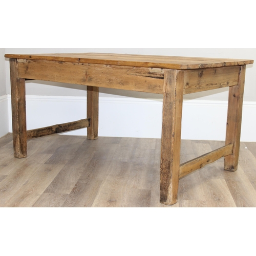 3 - An antique rustic pitch pine farmhouse table with single drawer, approx 145cm wide x 89cm deep x 75c... 