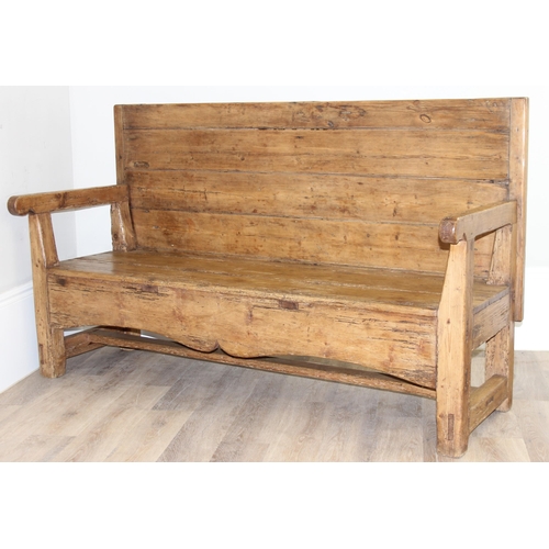 4 - An antique rustic pine high backed bench or settle, approx 175cm wide x 70cm deep x 105cm tall