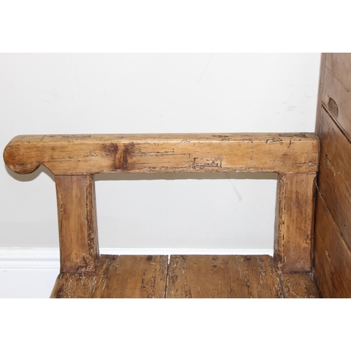 4 - An antique rustic pine high backed bench or settle, approx 175cm wide x 70cm deep x 105cm tall