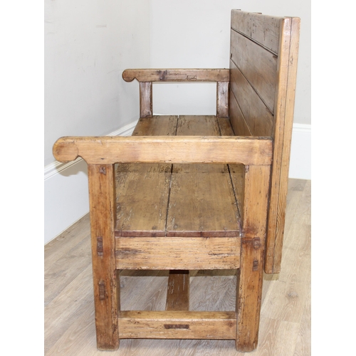 4 - An antique rustic pine high backed bench or settle, approx 175cm wide x 70cm deep x 105cm tall