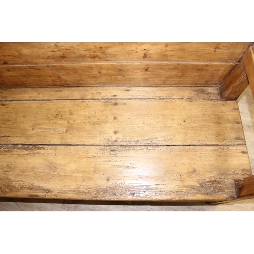 4 - An antique rustic pine high backed bench or settle, approx 175cm wide x 70cm deep x 105cm tall