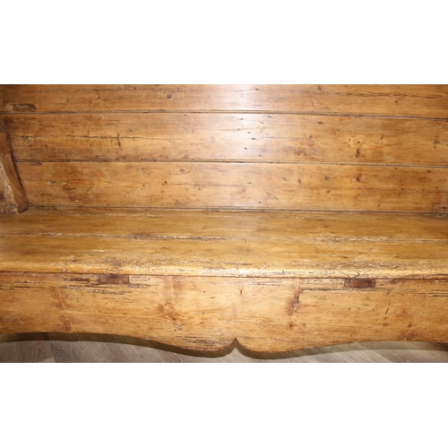 4 - An antique rustic pine high backed bench or settle, approx 175cm wide x 70cm deep x 105cm tall