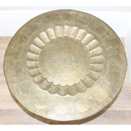 163 - A vintage brass topped folding Benares tray topped table, approx 75cm in diameter x 54cm tall