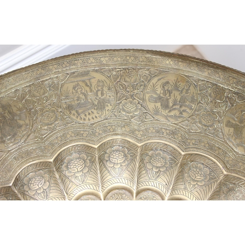 163 - A vintage brass topped folding Benares tray topped table, approx 75cm in diameter x 54cm tall